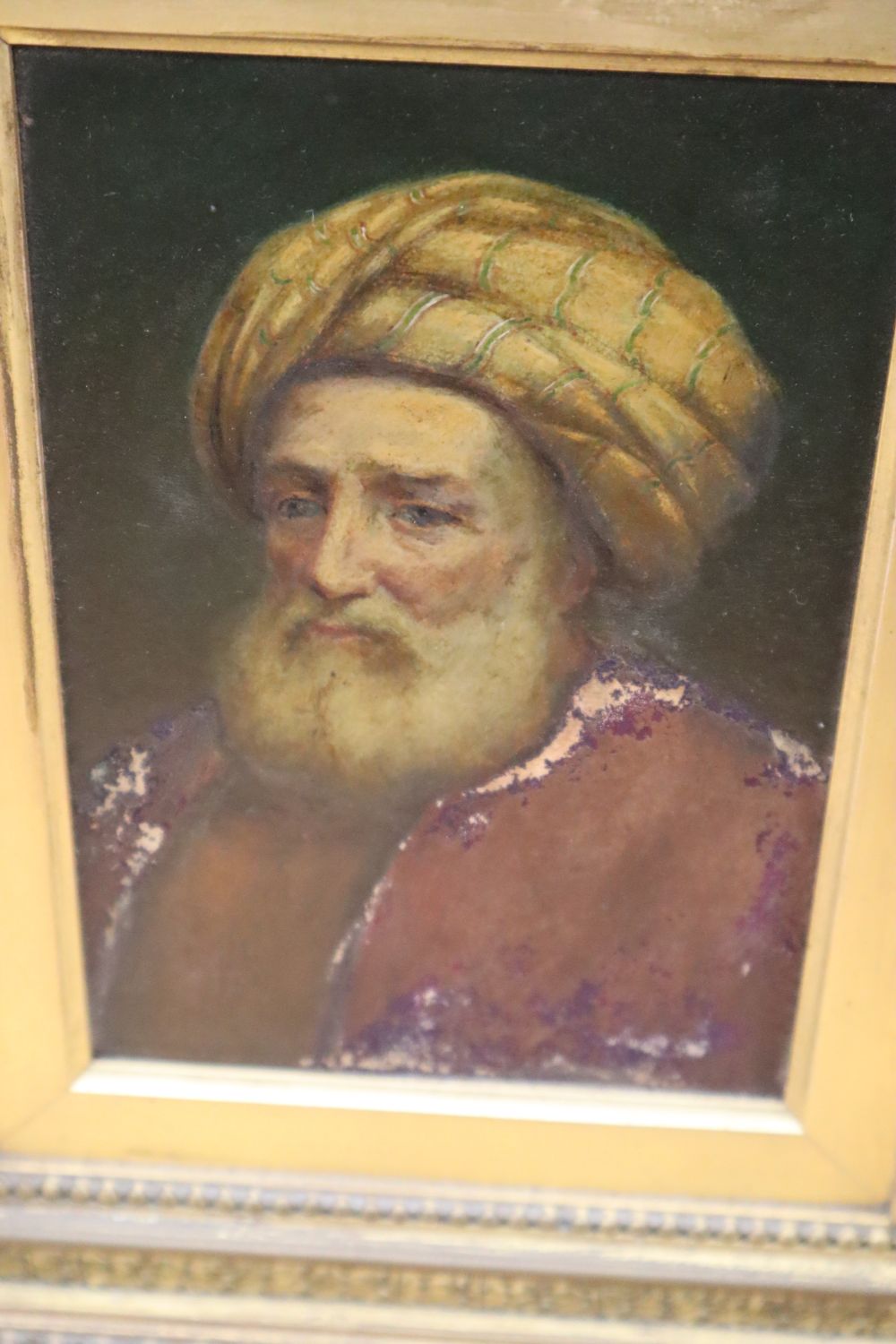 A 19th century Continental oil on board of a man wearing a turban and another oil on board of a river with shipping